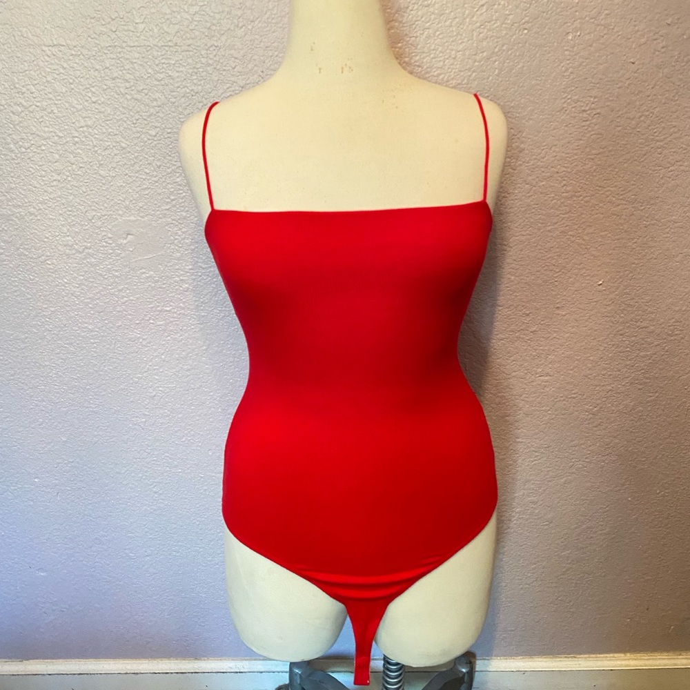 Woman’s red bodysuit